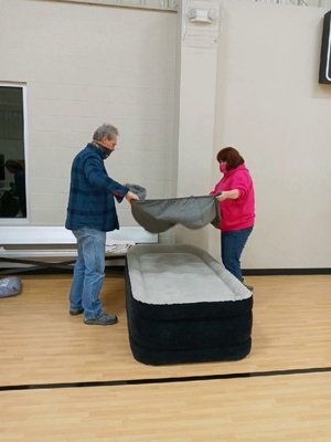 Making beds for our unhoused guest.