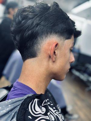 Burst fade done by Myo the barber.