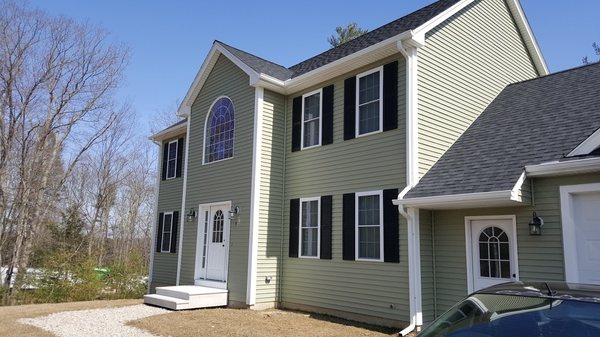 Custom new gutters and downspouts on a new house in Millbury.