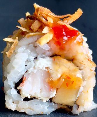 Pna Colada Mama
Tempura shrimp, pineapple and cream cheese  topped with sweet chili sauce and toasted coconut.