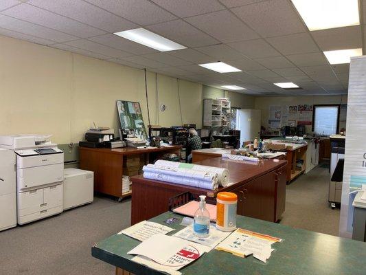 Louie at work. So many machines for coping or digital copies. Our go to shop for construction plan copies and other printing jobs.