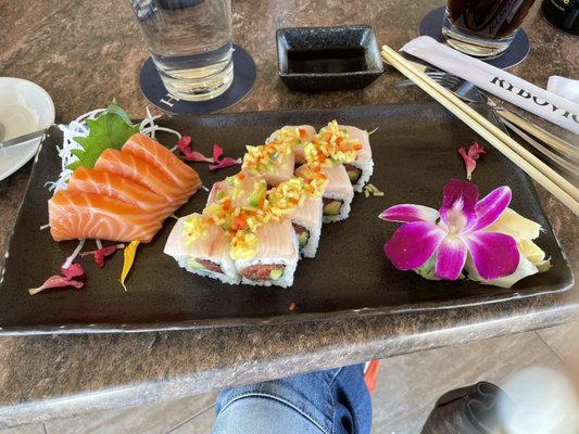 Hot mango sushi and salmon sashimi