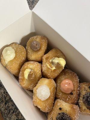 Assorted mini malasadas (coconut cream, Nutella fluff, Carmel cream, POG, Oreo, and haupia) seriously love all of them!!