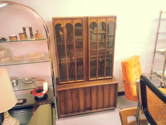 Lots of Vintage Modern, Retro, Eames Era and Danish Modern items in booth / room 307 here! Lighted walnut china cabinet.