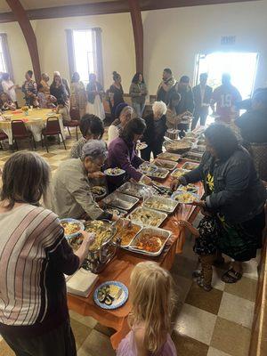 Fellowship in the hall with food from all cultures for combined service (Korean, Tongan, American, and African)