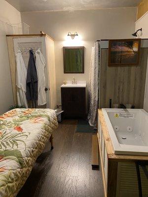 Exfoliation & mud treatment room with 
 Shower and whirlpool tub for "Forest Bathing" treatment of muscle recovery soaks.