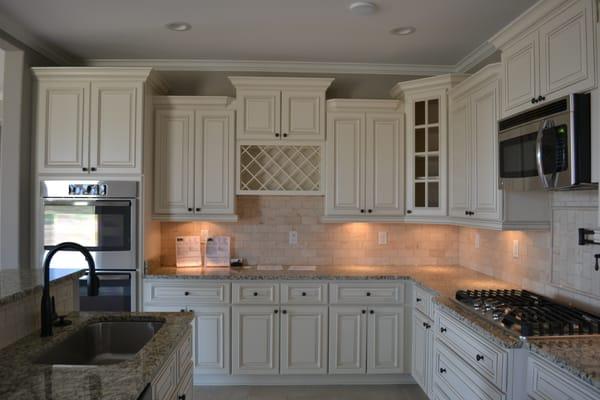 Beautiful kitchens in all of our homes. Tile backsplashes, potfillers above the cooktop.  Dovetailed, soft-close doors on all cabinets!