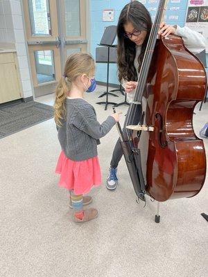 Younger children try the bass!