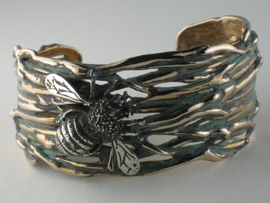 We create items with mixed metals.  This one is brass with sterling silver bee cuff bracelet.