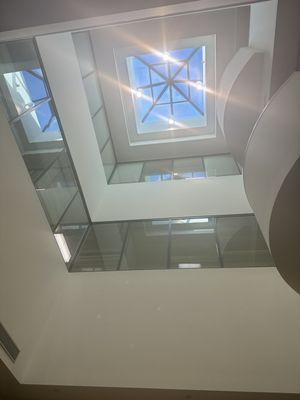 Looking up at the skylight in the middle of the building.