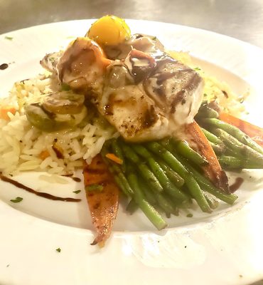 Grilled Mahi with roasted heirloom tomato Beurre Blanc