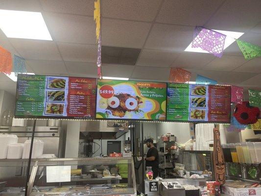 Menu display. They have breakfast tacos and ready to eat food!