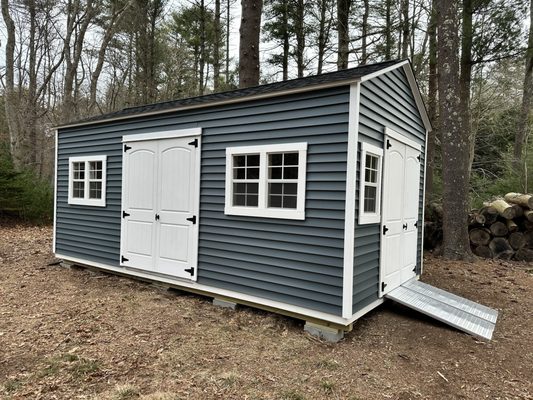 10 x 20 w/ vinyl siding that matches my house, vinyl doors, and galvanized steel ramp for the mower