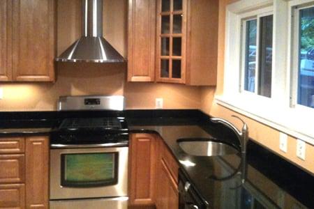 Toffee Maple Cabinet with Black Galaxy granite counter top in Bethesda, MD