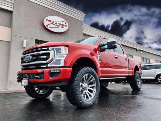 Ford Super Duty w/ Fuel Blitz D693 22x10 -18 Wheels, ReadyLIFT 2.5" SST Lift Kit and Nitto Ridge Grappler 37x13.50R22LT Tires.