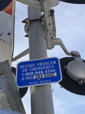 Railroad Crossing Helpline sign