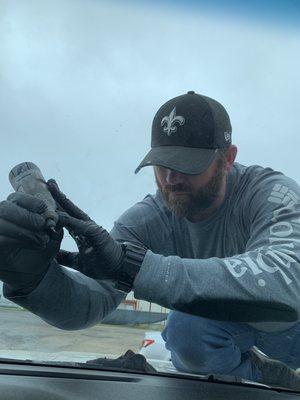 The owner, Eliot, hard at work repairing a windshield!