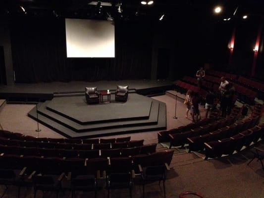 Horseshoe seating with center elevated stage makes this a good, comfortable venue for speakers.