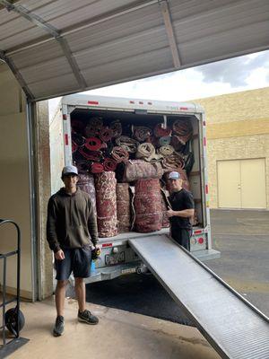 Helping a client out moving some rugs out of his wearhouse!