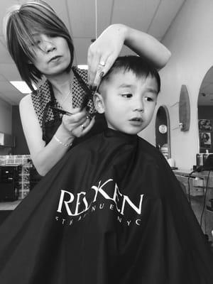 Boy getting a haircut , from the best hair stylist here !!