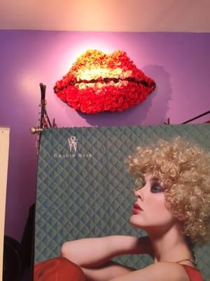 The dressing room at the Salon with one of owners images from Graham Webb w/a pair of paper mâché lips.