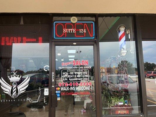 The outside entrance door to the Barbershop and Hair Salon