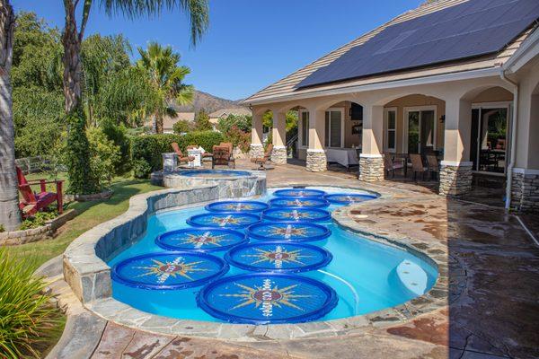 Solar Sun Rings with Sunburst design in pool.