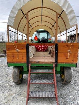 Covered wagon rides for an amazing trip up the mountain to pick your Christmas tree!