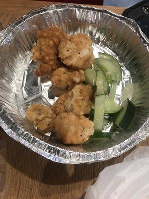 Snack-sized boneless wings with cut cucumbers on side