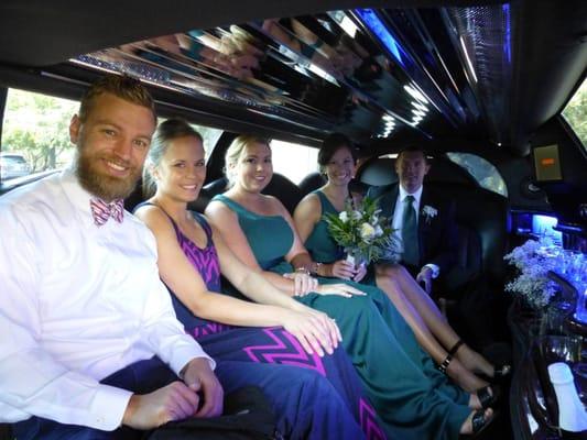 In the limo on our wedding day with our friends/photographers and bridesmaids & groomsmen!