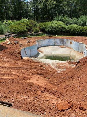 Pool demolition in progress