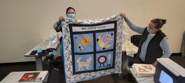 Project Linus meets at the store every week to work on their quilts for kids!