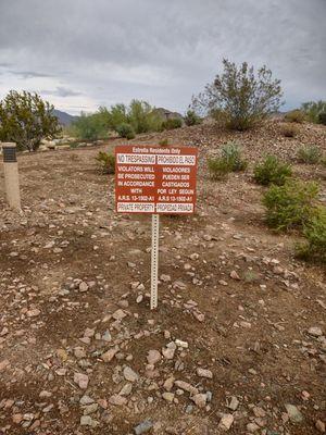 Sign warning visitors against trespassing near Estrella Star Tower