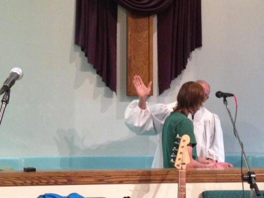 Ed Dowty baptizing Jessy Walters in water.