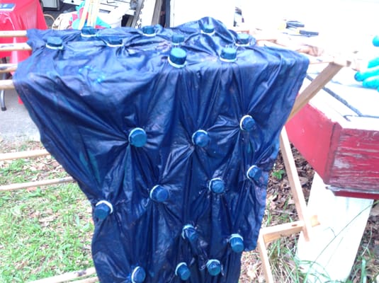 A wrapped sarong after being dipped in indigo.