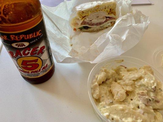 Turkey and Salami on a ciabatta roll with a side of potato salad and an ice cold Racer 5. It's nice to have a day off work.