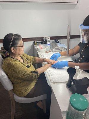 Grandma getting manicure by Elizabeth