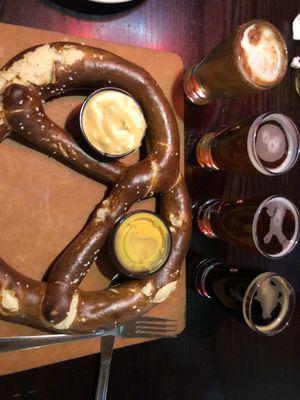 Pretzel and four samples of adult beverage