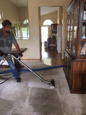 The owner is demonstrating a standard high pressure wand and how extremely clean he can get a very dirty carpet