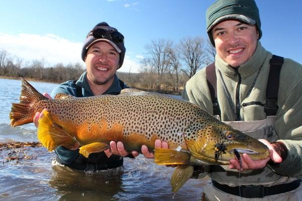 Winter streamer fishing is our game. Dally's guide Ben Levin (left) younger brother Gabe and Gabe's 32" 15lb brown Jan '10.