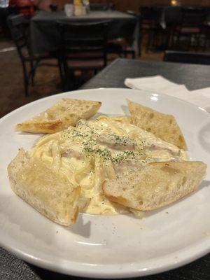 Chicken Alfredo. Good bread, good sauce, good pasta. One of the worst pieces of chicken I've ever had.