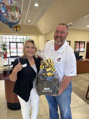 Karen Hanson, Gilbert Branch Manager, with customer and winner of the RBAZ 17th Anniversary raffle.