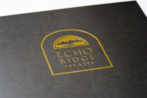 Gold-foil logo embossed on matte-finished folder.