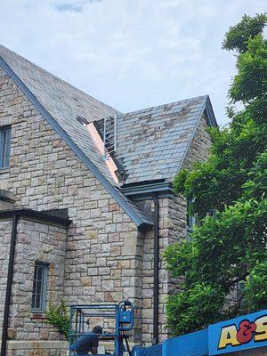 Copper valley replacement on a church slate roof.