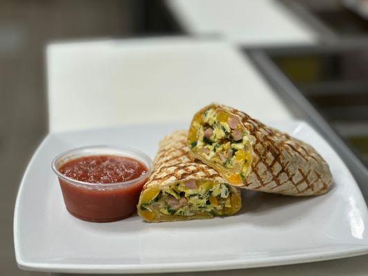 breakfast burrito - Your choice of tortilla stuffed with scrambled eggs, your choice of meat, crispy hash browns and cheese with grill marks