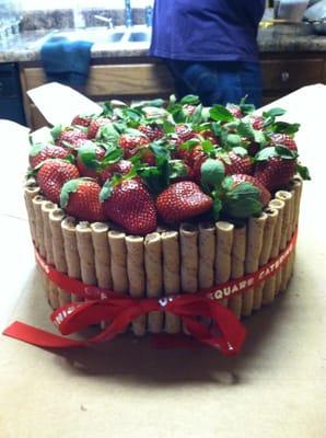 Delicious chocolate cake with strawberries on top! Love Off the Square Catering!