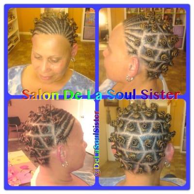 Natural style by Georgette. Bantu knots with flat twists in the front.