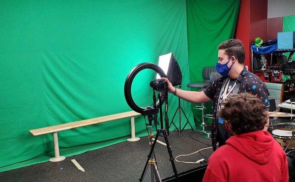 Students are brainstorming, filming and editing original videos for YouTube.