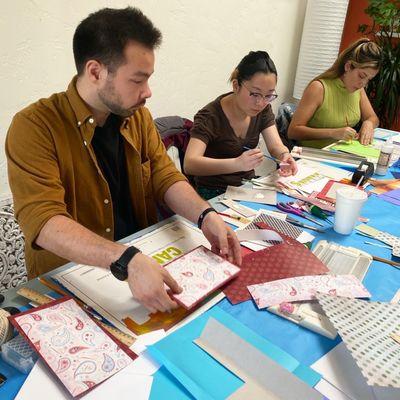 Students at a Japanese Stab Binding Workshop learn how to make their own journals by hand.