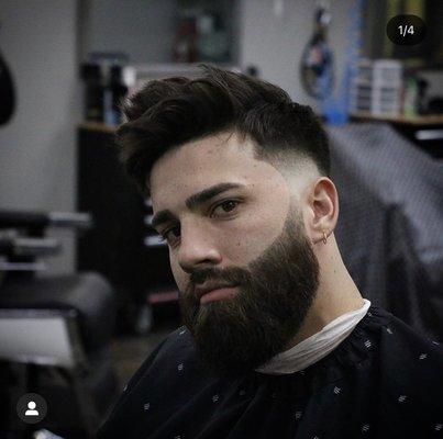 Mid drop fade, textured top with sculpted beard